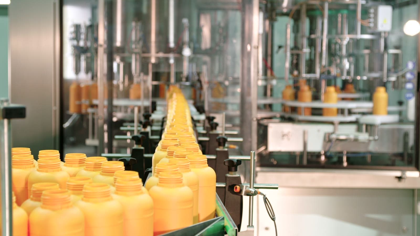 Bottles moving down a factory production line